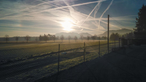 Scenic view of field against sky during sunset