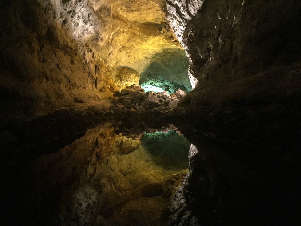 REFLECTION OF PERSON IN CAVE