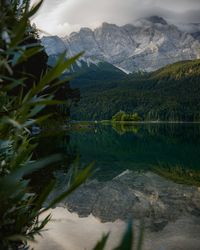 Scenic view of lake and mountains against sky