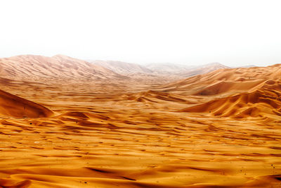 Scenic view of arid landscape against clear sky