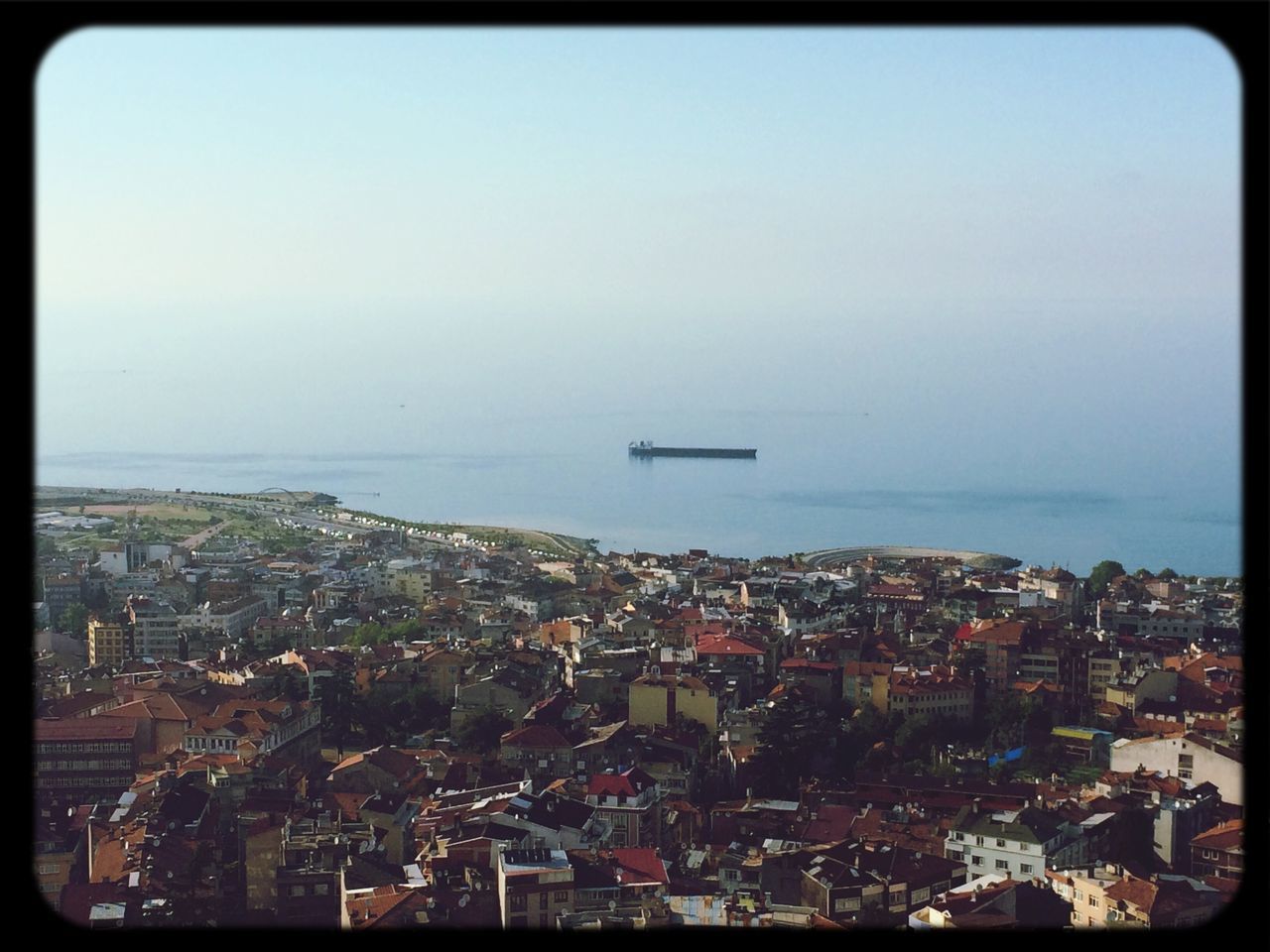 sea, transportation, mode of transport, cityscape, nautical vessel, city, transfer print, water, architecture, high angle view, horizon over water, building exterior, built structure, boat, auto post production filter, aerial view, crowded, sky, clear sky, copy space