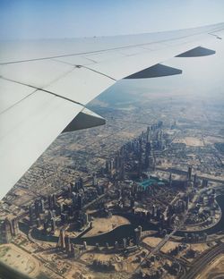 Aerial view of city against sky