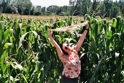 The girl posing on a cornfield with scarf