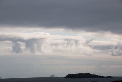 Scenic view of sea against cloudy sky