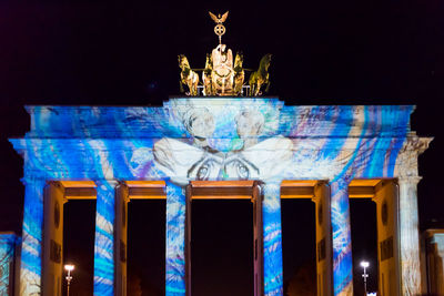 Low angle view of statue at night