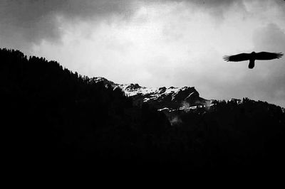 View of mountain range against cloudy sky