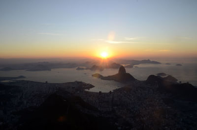 Scenic view of sunset over mountains