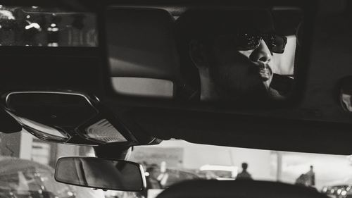 Man sitting in car