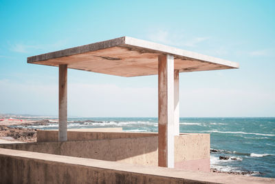 Gazebo against sea during sunny day