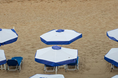 Empty lounge chairs on beach