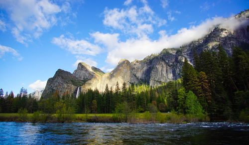 View of calm lake against mountain range