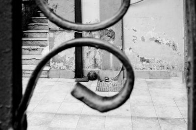 Reflection of woman on mirror against wall