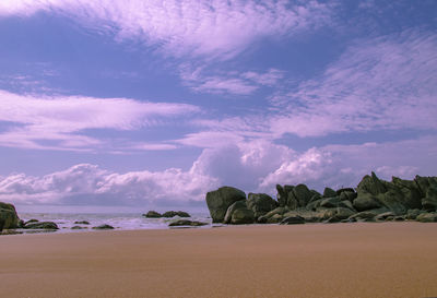 Scenic view of beach against sky during sunset