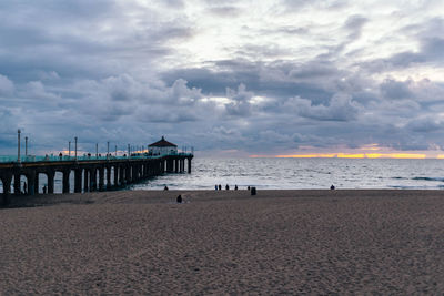 Scenic view of beach against sky during sunset