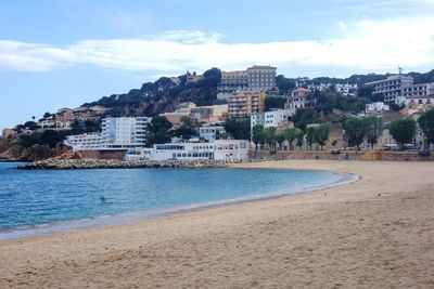 View of sea with buildings in background