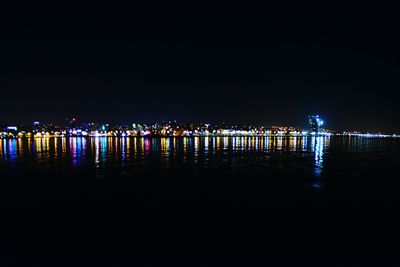 Illuminated sea at night