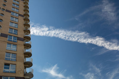 Low angle view of buildings against blue sky