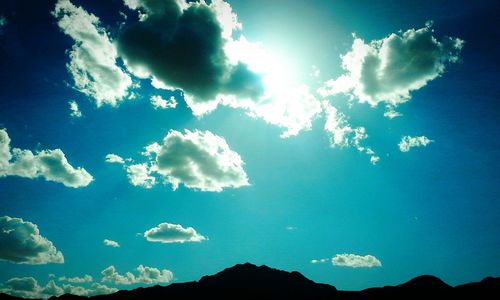 Low angle view of mountain against cloudy sky