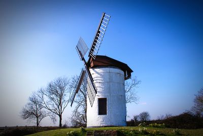 Low angle view of windmill against clear sky