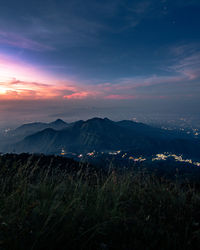 Scenic view of field against sky during sunset