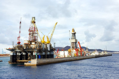 Offshore platform at sea against sky