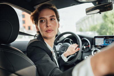 Portrait of woman sitting in car