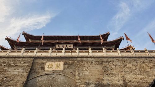 Low angle view of traditional building against sky