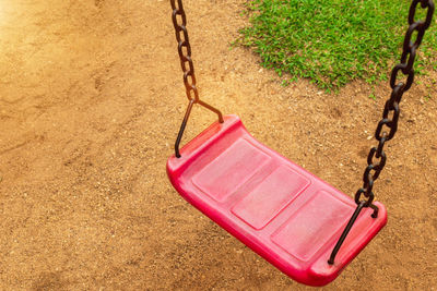 Close-up of swing at playground