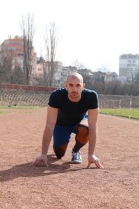 Portrait of man on running track