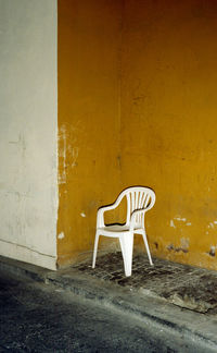 Empty chair in abandoned building