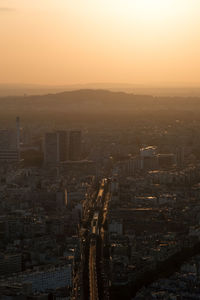 High angle view of city against sky during sunset