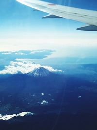 Aerial view of airplane wing over landscape