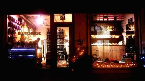 Man in illuminated building at night