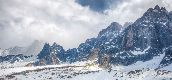 Scenic view of snow covered mountains