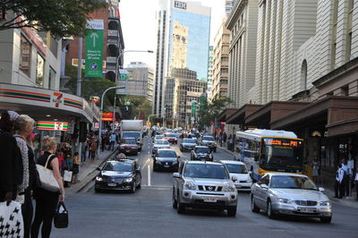 Vehicles on road along buildings