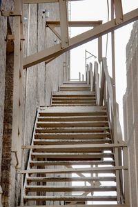 Low angle view of steps by building at construction site
