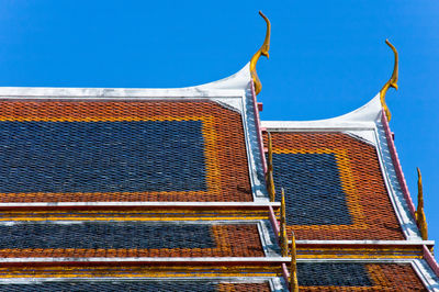 Low angle view of building against blue sky