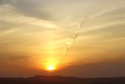 Scenic view of silhouette landscape against romantic sky at sunset
