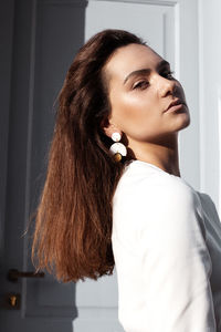 Portrait of a young woman looking away