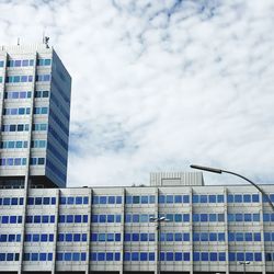 Low angle view of modern buildings against sky