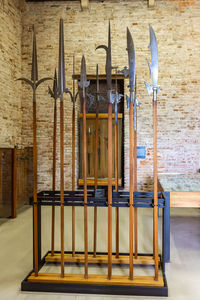 Close-up of empty chairs against wall in building