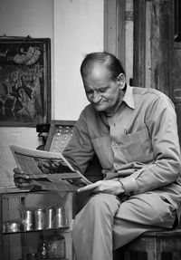 Man sitting on table at home