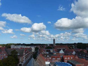 High angle view of townscape against blue sky