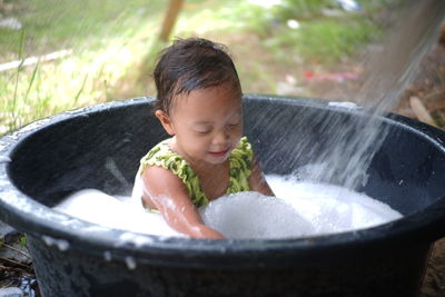 Boy looking away in water