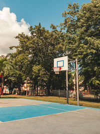 Simple side angle street urban basketball court portrait in a park of puerto rico in the evening.