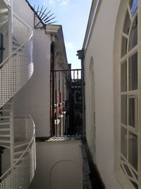 Empty alley amidst buildings in city