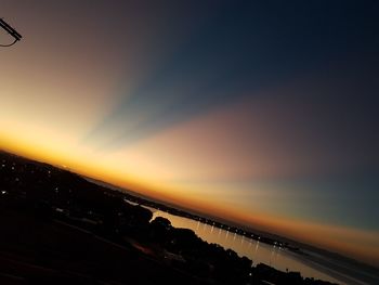 Silhouette bridge against sky during sunset