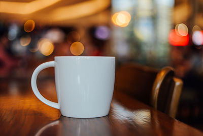 Close-up of coffee served on table at cafe