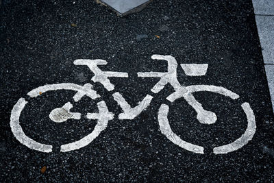 High angle view of road sign on street