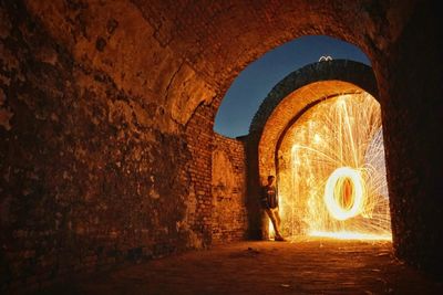 Illuminated archway in building